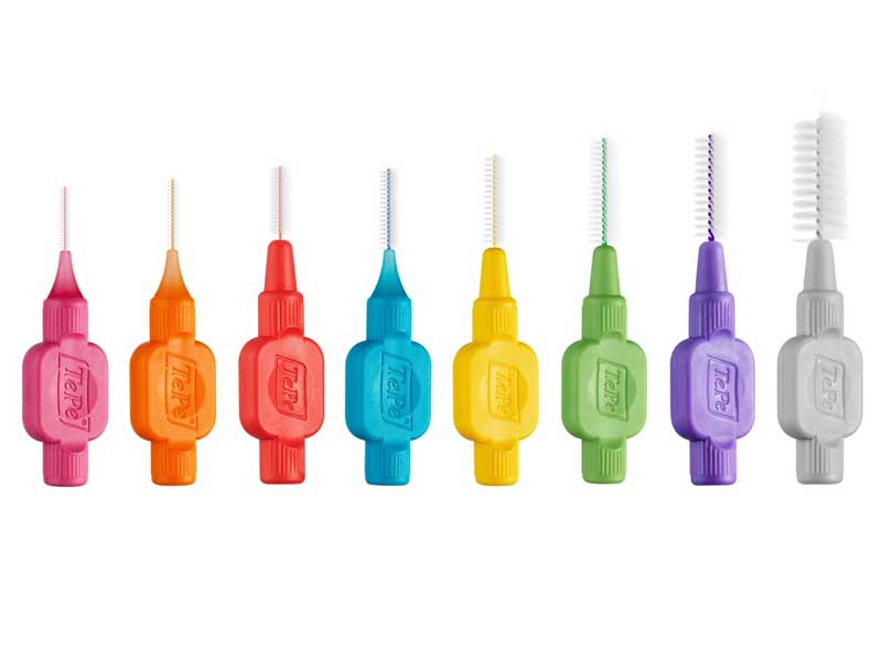 A range of different size and coloured interdental brushes. This is a interdental brush guide.
