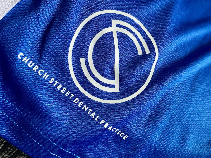 Church Street Dental Practice logo on the blue kits for AFC Houghton.